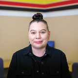 Indigenous support team member posing for photo.