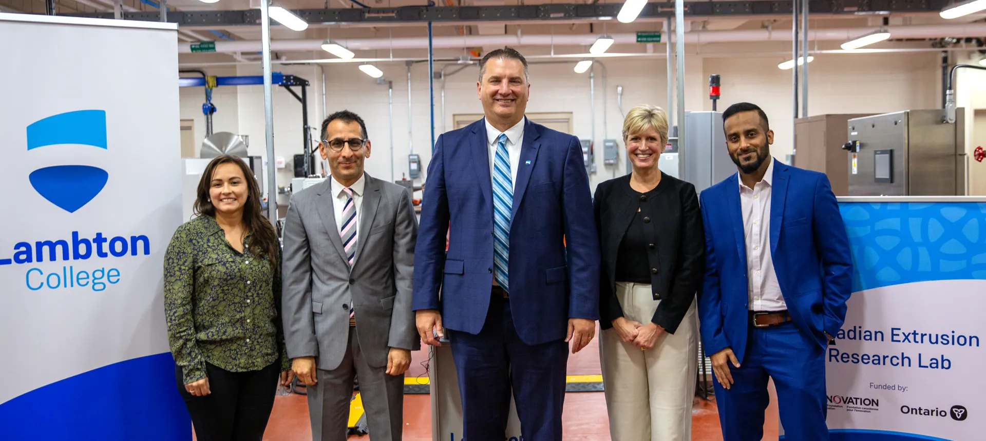 Lambton College administrative staff stand in front of the new Canadian Extrusion Research Laboratory