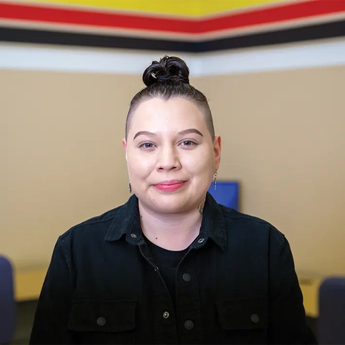 Indigenous support team member posing for photo.