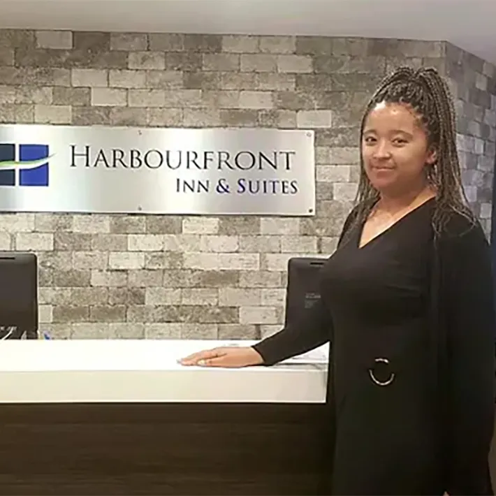 Women standing in front of a desk