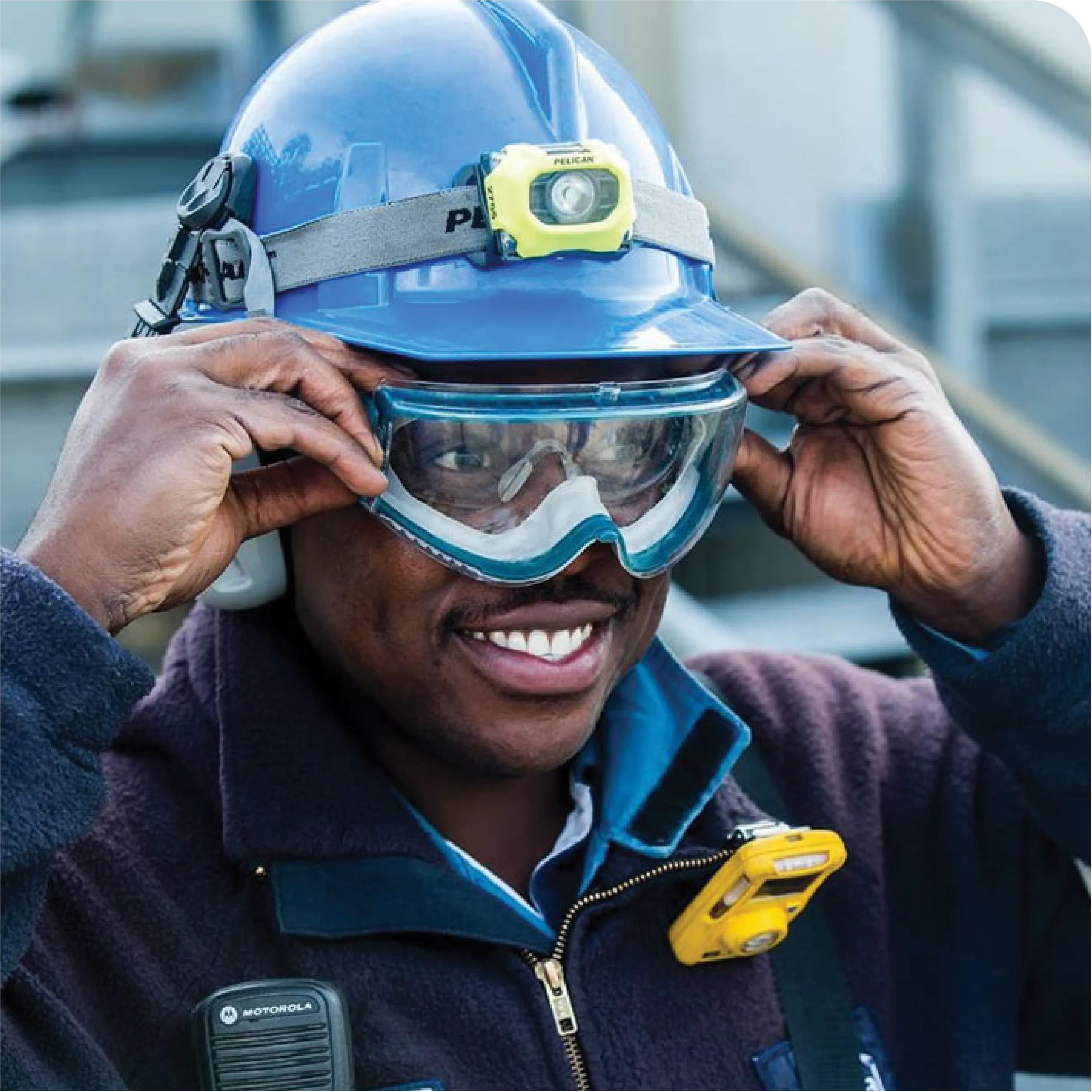 An image of an Imperial Oil employee wearing hard hat and safety googles.