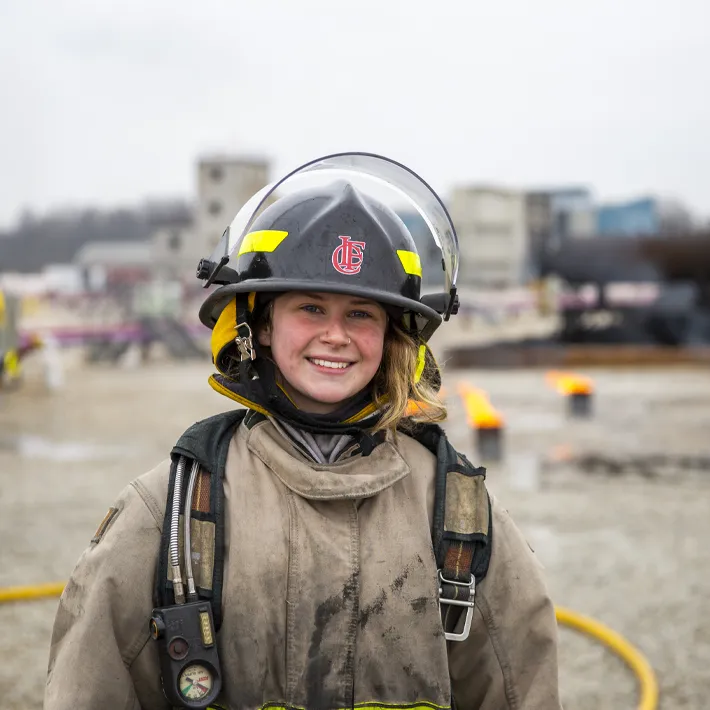 A fire student training outside.