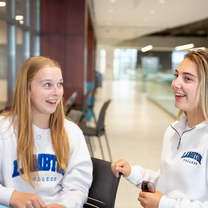 Students sitting at a table in Lambton College