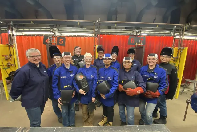 Group photo of students at Women of Steel event