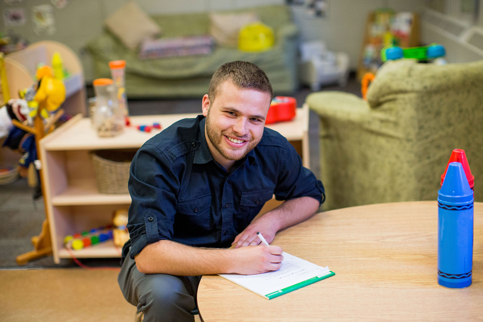 A Child and Youth Care graduate at work