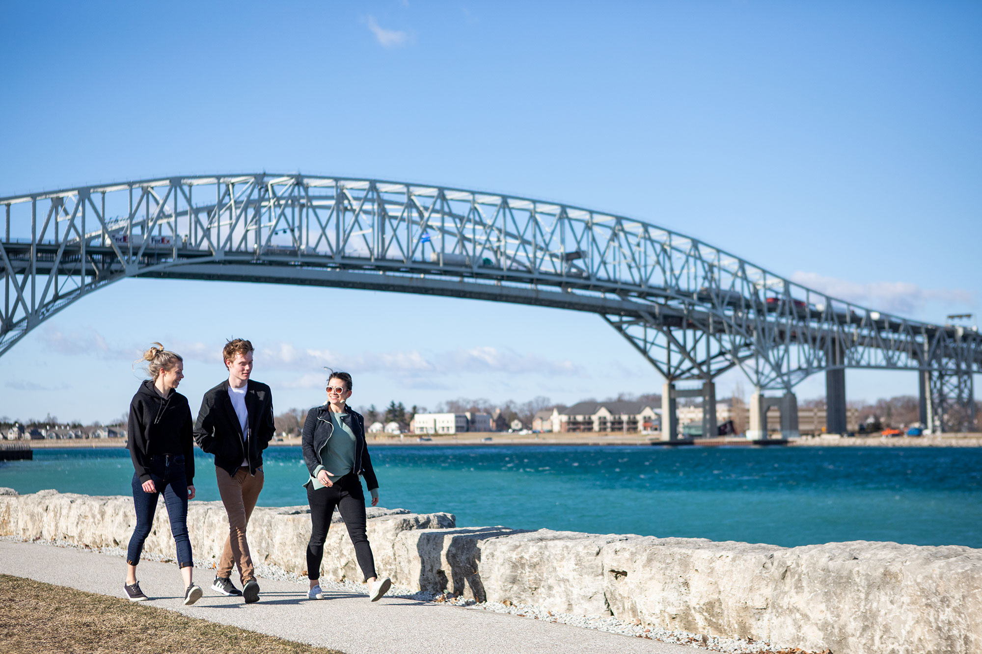 Students walking along the St. Clair river