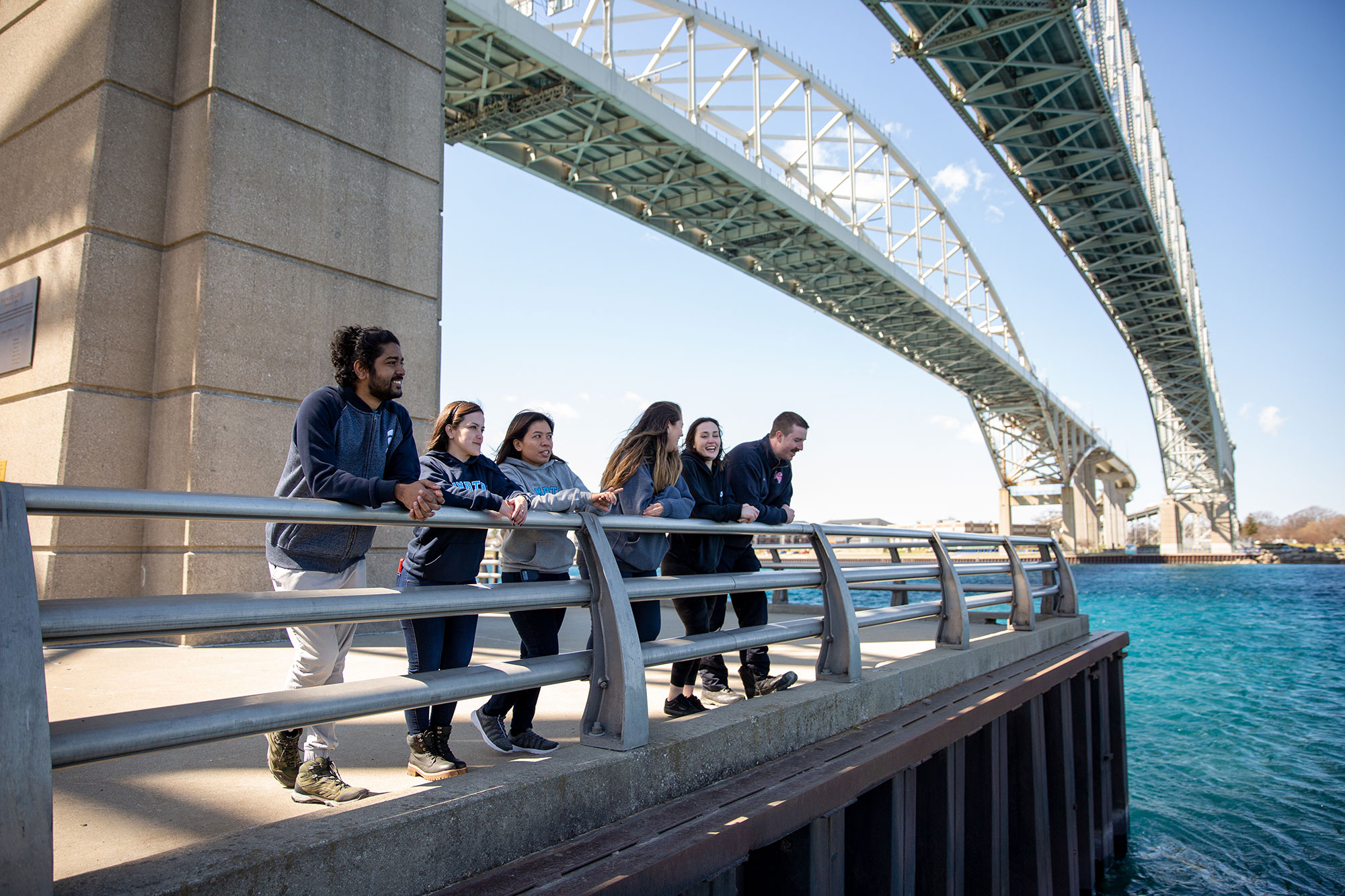 Students standing under the bluewater bridge